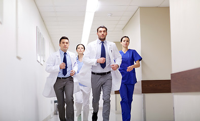 Image showing group of medics walking along hospital