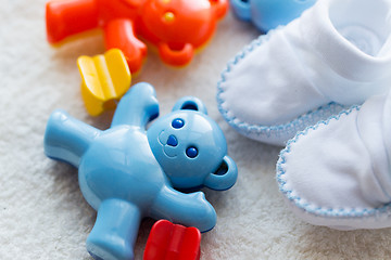 Image showing close up of baby rattle and bootees for newborn