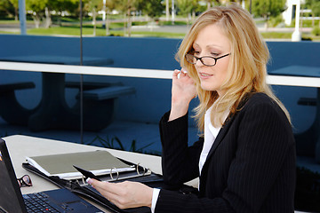 Image showing Business woman working outside on lunch break