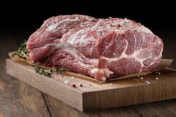 Image showing Photo of raw meat. Pork neck with herbs