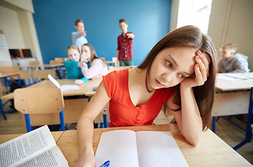 Image showing students gossiping behind classmate back at school