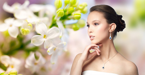 Image showing beautiful asian woman with earring and pendant