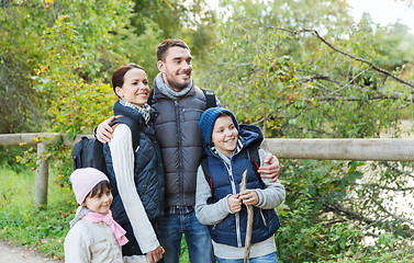 Image showing happy family with backpacks hiking