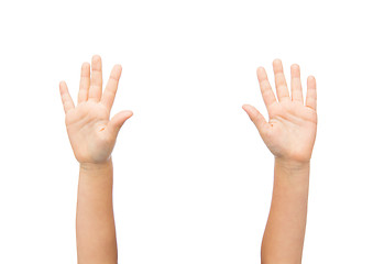 Image showing close up of little child hands raised upwards