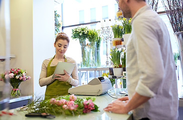 Image showing florist woman and man making order at flower shop
