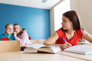 Image showing students gossiping behind classmate back at school