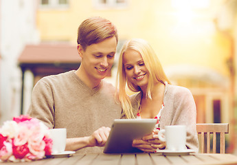 Image showing couple with tablet pc in cafe