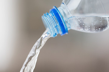 Image showing close up of water pouring from plastic bottle