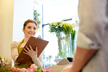 Image showing florist woman and man making order at flower shop