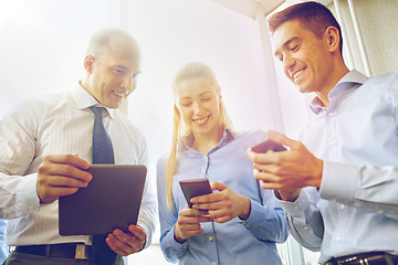 Image showing business people with tablet pc and smartphones