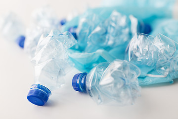 Image showing close up of used plastic bottles and rubbish bag