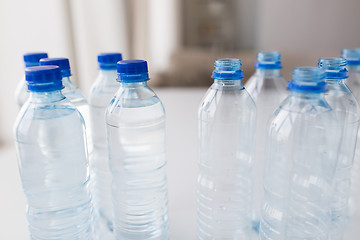 Image showing close up of bottles with drinking water on table