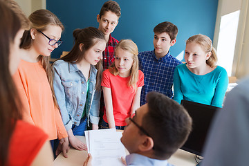 Image showing group of students and teacher with tests at school