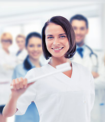 Image showing dentist with toothbrush in hospital