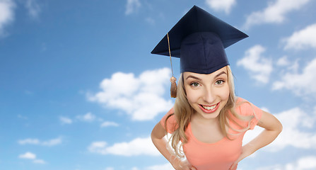 Image showing smiling young student woman in mortarboard