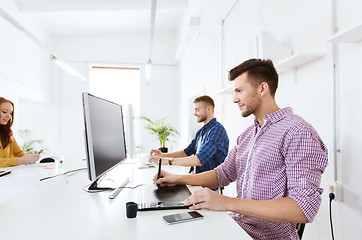 Image showing man or designer with computer and tablet at office