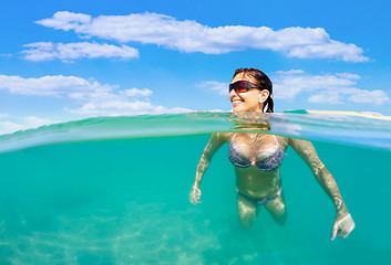 Image showing pretty woman swim in red sea