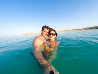 Image showing Couple having fun in the water summertime holidays