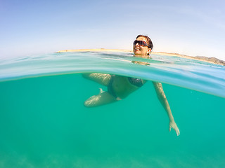 Image showing pretty woman swim in red sea