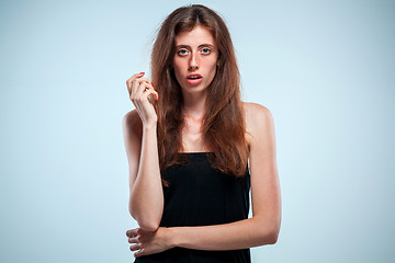 Image showing Portrait of young woman with shocked facial expression