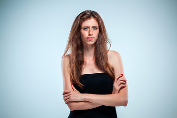 Image showing The disgusted and frowning young woman