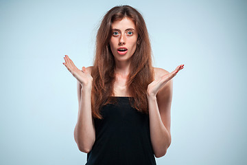 Image showing Portrait of young woman with shocked facial expression