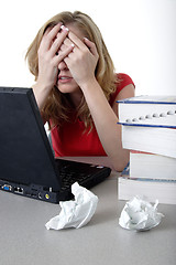 Image showing Frustrated woman working on computer
