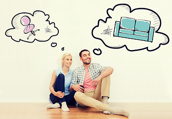 Image showing happy couple of man and woman moving to new home