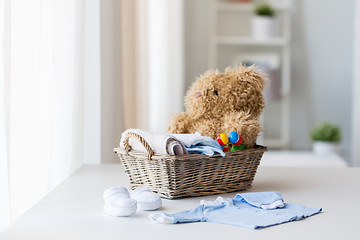 Image showing close up of baby clothes and toys for newborn