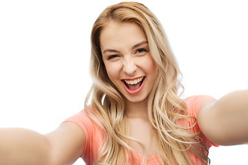 Image showing happy smiling young woman taking selfie