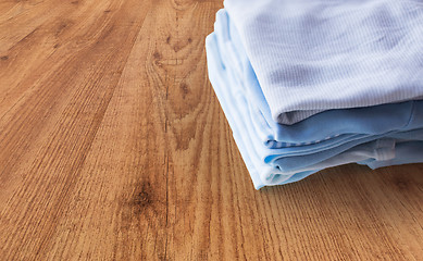 Image showing close up of baby boys clothes for newborn on table