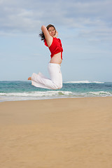 Image showing Girl jumping in the air