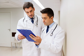 Image showing two male doctors with clipboard at hospital