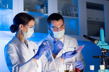 Image showing close up of scientists making test in lab