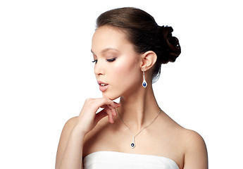 Image showing beautiful asian woman with earring and pendant