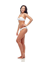 Image showing happy young woman in white bikini swimsuit