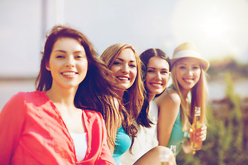 Image showing girls with drinks on the beach