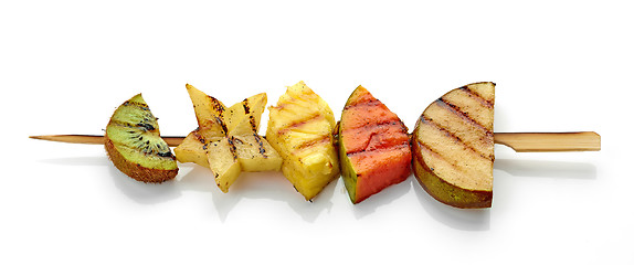 Image showing grilled fruit pieces on skewer