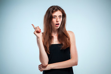 Image showing Portrait of young woman with shocked facial expression