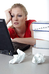 Image showing Tired girl doing homework