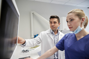 Image showing dentists with x-ray on monitor at dental clinic