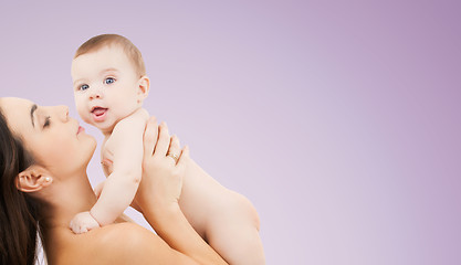 Image showing happy mother holding adorable baby