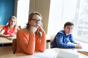 Image showing group of students with notebooks at school lesson