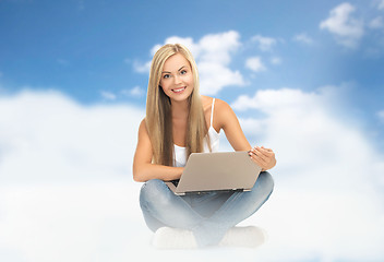 Image showing young woman sitting with laptop