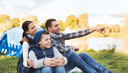 Image showing happy family with tent at camp site