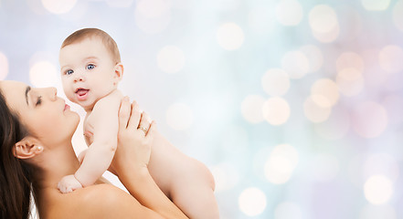 Image showing happy mother holding adorable baby