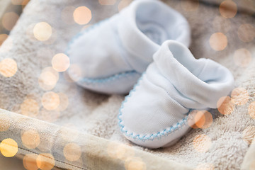 Image showing close up of baby bootees for newborn boy in basket