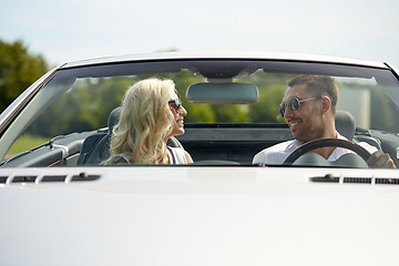 Image showing happy man and woman driving in cabriolet car