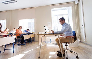 Image showing students and teacher with tablet pc at school