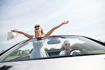 Image showing happy man and woman driving in cabriolet car